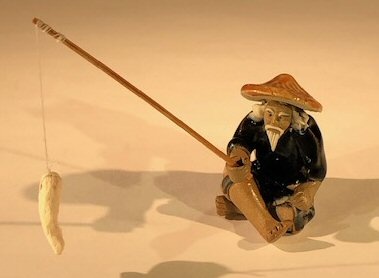 Miniature Ceramic Figurine - Glazed Fisherman 1.75" Tall