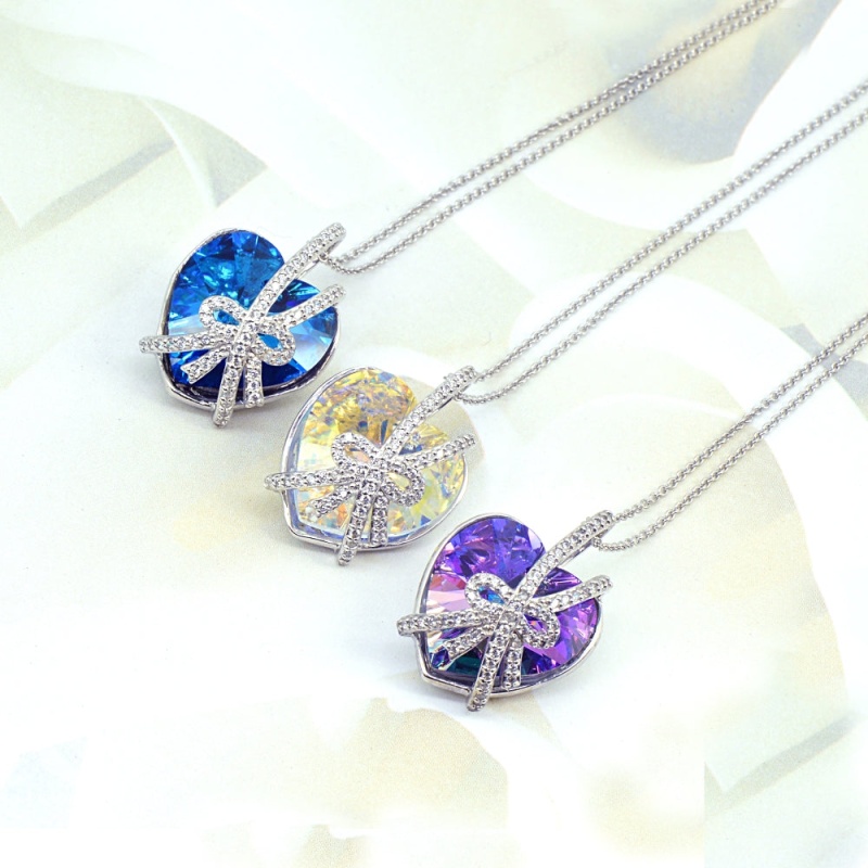 Swarovski Crystal, Sterling Silver Bermuda Blue Bow Tie Engraved “A Gift Of Love” Heart Necklace